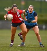 15 March 2025; Ava Looney of MTU Cork in action against Saoirse Murphy of UCD 2 during the 2025 Ladies AIG Lynch final match between MTU Cork and UCD at Queen's Sport, Queens University, Belfast. Photo by Ben McShane/Sportsfile