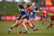 15 March 2025; Ava Looney of MTU Cork in action against Saoirse Murphy, behind, and Orla Devlin of UCD 2 during the 2025 Ladies AIG Lynch final match between MTU Cork and UCD at Queen's Sport, Queens University, Belfast. Photo by Ben McShane/Sportsfile