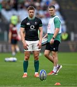 15 March 2025; Jack Crowley of Ireland warms-up as Ireland assistant coach Jonathan Sexton watches on before the Guinness Six Nations Rugby Championship match between Italy and Ireland at the Stadio Olimpico in Rome, Italy. Photo by Seb Daly/Sportsfile