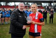 15 March 2025; Katie O'Driscoll of MTU Cork is presented with the Player of the Match award by Ladies HEC Chairperson Daniel Caldwell after the 2025 Ladies AIG Lynch final match between MTU Cork and UCD at Queen's Sport, Queens University, Belfast. Photo by Ben McShane/Sportsfile