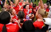 15 March 2025; MTU Cork captain Rachael Evans celebrates with her teammates and the Lynch Cup after the 2025 Ladies AIG Lynch final match between MTU Cork and UCD at Queen's Sport, Queens University, Belfast. Photo by Ben McShane/Sportsfile