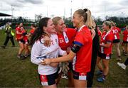 15 March 2025; MTU Cork players, from left, goalkeeper Molly Murphy, Seoighe English and Katie O'Driscoll celebrate after the 2025 Ladies AIG Lynch final match between MTU Cork and UCD at Queen's Sport, Queens University, Belfast. Photo by Ben McShane/Sportsfile