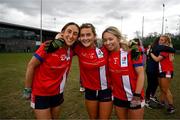 15 March 2025; MTU Cork players, from left, Eimear Boland, Ellen Moore and Siobhan Callanan celebrate after the 2025 Ladies AIG Lynch final match between MTU Cork and UCD at Queen's Sport, Queens University, Belfast. Photo by Ben McShane/Sportsfile