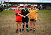 15 March 2025; Referee Eddie Cuthbert with team captains Rachel Sheehan of UCC, left, and Emma Duggan of DCU Dóchas Éireann before the 2025 Ladies AIG O’Connor Cup final match between DCU Dóchas Éireann and UCC at Queen's Sport, Queens University, Belfast. Photo by Ben McShane/Sportsfile