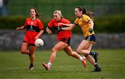 15 March 2025; Rosie Corkery of UCC in action against Maria Cannon of DCU Dóchas Éireann during the 2025 Ladies AIG O’Connor Cup final match between DCU Dóchas Éireann and UCC at Queen's Sport, Queens University, Belfast. Photo by Ben McShane/Sportsfile