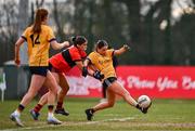 15 March 2025; Clodagh Lohan of DCU Dóchas Éireann scores her side's first goal despite the attention of Eve Power of UCC during the 2025 Ladies AIG O’Connor Cup final match between DCU Dóchas Éireann and UCC at Queen's Sport, Queens University, Belfast. Photo by Ben McShane/Sportsfile