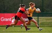 15 March 2025; Kate Kenny of DCU Dóchas Éireann in action against Eve Power of UCC during the 2025 Ladies AIG O’Connor Cup final match between DCU Dóchas Éireann and UCC at Queen's Sport, Queens University, Belfast. Photo by Ben McShane/Sportsfile