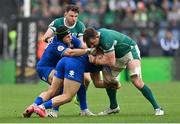 15 March 2025; Jack Conan of Ireland is tackled by Juan Ignacio Brex, left, and Tommaso Menoncello of Italy during the Guinness Six Nations Rugby Championship match between Italy and Ireland at the Stadio Olimpico in Rome, Italy. Photo by Ramsey Cardy/Sportsfile