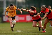 15 March 2025; Leah Fox of DCU Dóchas Éireann in action against Dara Kiniry, centre, and Rosie Corkery of UCC during the 2025 Ladies AIG O’Connor Cup final match between DCU Dóchas Éireann and UCC at Queen's Sport, Queens University, Belfast. Photo by Ben McShane/Sportsfile