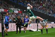 15 March 2025; Mack Hansen of Ireland keeps the ball in play to assist team-mate Dan Sheehan's try during the Guinness Six Nations Rugby Championship match between Italy and Ireland at the Stadio Olimpico in Rome, Italy. Photo by Ramsey Cardy/Sportsfile