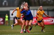 15 March 2025; Emma Morrissey of UCC gets past the tackle of DCU Dóchas Éireann goalkeeper Robyn Murray on her way to scoring her side's first goal during the 2025 Ladies AIG O’Connor Cup final match between DCU Dóchas Éireann and UCC at Queen's Sport, Queens University, Belfast. Photo by Ben McShane/Sportsfile