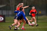 15 March 2025; Emma Morrissey of UCC scores her side's first goal despite the tackle of DCU Dóchas Éireann goalkeeper Robyn Murray during the 2025 Ladies AIG O’Connor Cup final match between DCU Dóchas Éireann and UCC at Queen's Sport, Queens University, Belfast. Photo by Ben McShane/Sportsfile