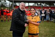 15 March 2025; Clodagh Lohan of DCU Dóchas Éireann is presented with the Player of the Match award by Ladies HEC Chairperson, Daniel Caldwell after the 2025 Ladies AIG O’Connor Cup final match between DCU Dóchas Éireann and UCC at Queen's Sport, Queens University, Belfast. Photo by Ben McShane/Sportsfile
