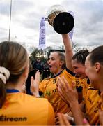 15 March 2025; DCU Dóchas Éireann captain Emma Duggan celebrates with the AIG O'Connor Cup and her teammates after the 2025 Ladies AIG O’Connor Cup final match between DCU Dóchas Éireann and UCC at Queen's Sport, Queens University, Belfast. Photo by Ben McShane/Sportsfile
