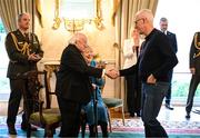 15 March 2025; President of Ireland Michael D Higgins and his wife Sabina with Mick McCarthy, team captain of the Republic of Ireland squad from the Italia 1990 FIFA World Cup at Áras an Uachtaráin in Dublin. Photo by Stephen McCarthy/Sportsfile
