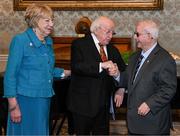 15 March 2025; President of Ireland Michael D Higgins and wife Sabina with kitman Charlie O’Leary of the Republic of Ireland squad from the Italia 1990 FIFA World Cup at Áras an Uachtaráin in Dublin. Photo by Stephen McCarthy/Sportsfile