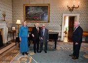 15 March 2025; President of Ireland Michael D Higgins and wife Sabina with kitman Charlie O’Leary and his son John, right, of the Republic of Ireland squad from the Italia 1990 FIFA World Cup at Áras an Uachtaráin in Dublin. Photo by Stephen McCarthy/Sportsfile