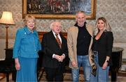 15 March 2025; President of Ireland Michael D Higgins and wife Sabina with Chris Morris and wife Paula of the Republic of Ireland squad from the Italia 1990 FIFA World Cup at Áras an Uachtaráin in Dublin. Photo by Stephen McCarthy/Sportsfile