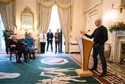 15 March 2025; Mick McCarthy of the Republic of Ireland squad from the Italia 1990 FIFA World Cup addresses the room including President of Ireland Michael D Higgins and wife Sabina at Áras an Uachtaráin in Dublin. Photo by Stephen McCarthy/Sportsfile