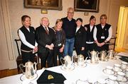 15 March 2025; President of Ireland Michael D Higgins and team captain Mick McCarthy of the Republic of Ireland squad from the Italia 1990 FIFA World Cup pose for a photograph with staff at Áras an Uachtaráin in Dublin. Photo by Stephen McCarthy/Sportsfile