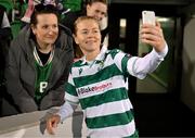 15 March 2025; Ruesha Littlejohn of Shamrock Rovers with a supporter after the SSE Airtricity Women's Premier Division match between Shamrock Rovers and Athlone Town at Tallaght Stadium in Dublin. Photo by Stephen Marken/Sportsfile