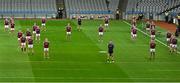 15 March 2025; Galway players during a minute's silence for former Galway footballer Billy Joyce, uncle of current Galway manager Pádraic Joyce, before the Allianz Football League Division 1 match between Dublin and Galway at Croke Park in Dublin. Photo by Piaras Ó Mídheach/Sportsfile