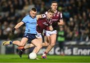 15 March 2025; Con O'Callaghan of Dublin takes a shot on goal as Johnny McGrath of Galway closes in during the Allianz Football League Division 1 match between Dublin and Galway at Croke Park in Dublin. Photo by Piaras Ó Mídheach/Sportsfile