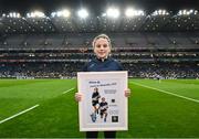 15 March 2025: Ava Connellan of St Pius X NS Terenure with her award for best player for the Allianz Cumann na mBunscol Finals at half-time in Saturday’s Allianz Football League Division 1 match between Dublin and Galway at Croke Park. Photo by Piaras Ó Mídheach/Sportsfile
