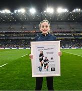 15 March 2025: Ava Connellan of St Pius X NS Terenure with her award for best player for the Allianz Cumann na mBunscol Finals at half-time in Saturday’s Allianz Football League Division 1 match between Dublin and Galway at Croke Park. Photo by Piaras Ó Mídheach/Sportsfile