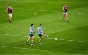 15 March 2025; Seán Bugler of Dublin, 12, kicks the ball out over the sideline to end the game after the hooter had went in the second half during the Allianz Football League Division 1 match between Dublin and Galway at Croke Park in Dublin. Photo by Piaras Ó Mídheach/Sportsfile