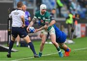 15 March 2025; Mack Hansen of Ireland is tackled by Ross Vintcent of Italy during the Guinness Six Nations Rugby Championship match between Italy and Ireland at the Stadio Olimpico in Rome, Italy. Photo by Ramsey Cardy/Sportsfile
