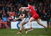 16 March 2025; Frank Irwin of Mayo in action against Padraig McGrogan of Derry during the Allianz Football League Division 1 match between Derry and Mayo at Celtic Park in Derry. Photo by Ben McShane/Sportsfile