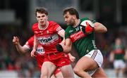 16 March 2025; Aidan O'Shea of Mayo in action against Eoin McEvoy of Derry during the Allianz Football League Division 1 match between Derry and Mayo at Celtic Park in Derry. Photo by Ben McShane/Sportsfile