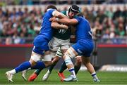 15 March 2025; Caelan Doris of Ireland is tackled by Dino Lamb, left, and Danilo Fischetti of Italy during the Guinness Six Nations Rugby Championship match between Italy and Ireland at the Stadio Olimpico in Rome, Italy. Photo by Seb Daly/Sportsfile