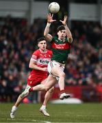 16 March 2025; Sam Callinan of Mayo in action against Conor Doherty of Derry during the Allianz Football League Division 1 match between Derry and Mayo at Celtic Park in Derry. Photo by Ben McShane/Sportsfile