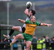 16 March 2025; Tyrone goalkeeper Niall Morgan wins possession ahead of Michael Murphy of Donegal during the Allianz Football League Division 1 match between Donegal and Tyrone at O’Donnell Park in Letterkenny, Donegal. Photo by Piaras Ó Mídheach/Sportsfile
