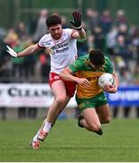 16 March 2025; Odhran McFadden Ferry of Donegal in action against Joe Oguz of Tyrone during the Allianz Football League Division 1 match between Donegal and Tyrone at O’Donnell Park in Letterkenny, Donegal. Photo by Piaras Ó Mídheach/Sportsfile