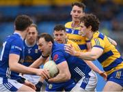 16 March 2025; Gearoid McKiernan of Cavan is tackled by Keith Doyle of Roscommon during the Allianz Football League Division 2 match between Roscommon and Cavan at King & Moffatt Dr Hyde Park in Roscommon. Photo by Tom Beary/Sportsfile