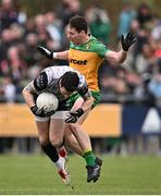 16 March 2025; Tyrone goalkeeper Niall Morgan in action against Jamie Brennan of Donegal during the Allianz Football League Division 1 match between Donegal and Tyrone at O’Donnell Park in Letterkenny, Donegal. Photo by Piaras Ó Mídheach/Sportsfile