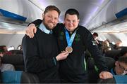 16 March 2025; Bronze Medal winner Jack Buckley of Team Ireland, a member of Mallow Special Olympics Club, Mallow, Cork with William McNally, Aer Lingus Cabin Crew member on the flight to Dublin after competing in the Turin 2025 Special Olympics World Winter Games in Italy. Photo by Ray McManus/Sportsfile