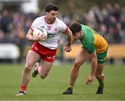 16 March 2025; Darren McCurry of Tyrone in action against Odhean McFadden of Donegal during the Allianz Football League Division 1 match between Donegal and Tyrone at O’Donnell Park in Letterkenny, Donegal. Photo by Piaras Ó Mídheach/Sportsfile