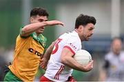 16 March 2025; Darren McCurry of Tyrone in action against Odhean McFadden of Donegal during the Allianz Football League Division 1 match between Donegal and Tyrone at O’Donnell Park in Letterkenny, Donegal. Photo by Piaras Ó Mídheach/Sportsfile