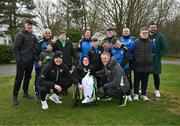 17 March 2025; Head coach Heimir Hallgrimsson and assistant head coach John O'Shea, left, pose for a photograph with members of the Finglas United Football For All team following a Republic of Ireland training session at the FAI National Training Centre in Abbotstown, Dublin. Photo by Stephen McCarthy/Sportsfile