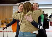 17 March 2025; Aoife, left, and Lisa O’Rourke of Ireland with the silver medals they won in their respective Elite Women 70-75kg middleweight and 66-70kg light middleweight final bouts at the 2025 IBA Women's World Boxing Championships finals are congratulated by their mother Ann upon their arrival at Dublin Airport from the IBA Women's World Boxing Championships in Niš, Serbia. Photo by Ray McManus/Sportsfile