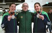 17 March 2025; Aoife, right, and Lisa O’Rourke of Ireland with the silver medals they won in their respective Elite Women 70-75kg middleweight and 66-70kg light middleweight final bouts at the 2025 IBA Women's World Boxing Championships finals are congratulated by Irish Athletic Boxing Association President Anto Donnelly upon their arrival at Dublin Airport from the IBA Women's World Boxing Championships in Niš, Serbia. Photo by Ray McManus/Sportsfile