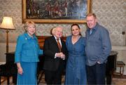 15 March 2025; President of Ireland Michael D Higgins and wife Sabina with Steve Staunton and wife Lynda of the Republic of Ireland squad from the Italia 1990 FIFA World Cup at Áras an Uachtaráin in Dublin. Photo by Stephen McCarthy/Sportsfile
