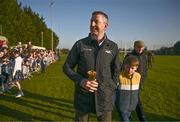 18 March 2025; Trainer Gavin Cromwell with his son Cameron during homecoming celebrations for Cheltenham Gold Cup winner Inothewayurthinkin at Skryne Gaelic Football Club in Tara, Meath. Photo by Ben McShane/Sportsfile