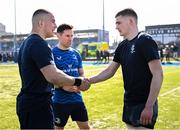 19 March 2025; St Michael's College captain Herbie Boyle, left, shakes hands with St Vincent's Castleknock College captain Matthew Lynch, alongside referee Ross Shaughnessy, before the Bank of Ireland Leinster Rugby Boys Schools Junior Cup final match between St Michael’s College and St Vincent's Castleknock College at Energia Park in Dublin. Photo by Shauna Clinton/Sportsfile