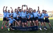 19 March 2025; St Michael's College captain Herbie Boyle lifts the cup with team-mates after their side's victory in the Bank of Ireland Leinster Rugby Boys Schools Junior Cup final match between St Michael’s College and St Vincent's Castleknock College at Energia Park in Dublin. Photo by Shauna Clinton/Sportsfile