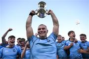 19 March 2025; St Michael's College captain Herbie Boyle lifts the cup with team-mates after their side's victory in the Bank of Ireland Leinster Rugby Boys Schools Junior Cup final match between St Michael’s College and St Vincent's Castleknock College at Energia Park in Dublin. Photo by Shauna Clinton/Sportsfile